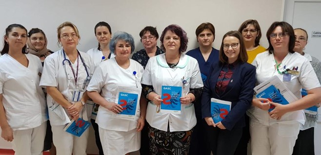 •	Stroke team in the Emergency County Hospital of Romania holding QASC booklets. 