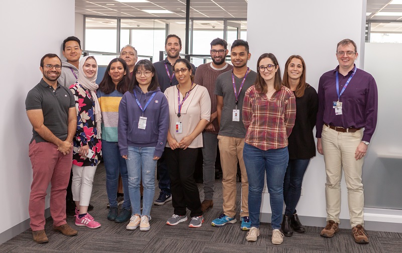 Photo of Associate Professor David Ascher with his team