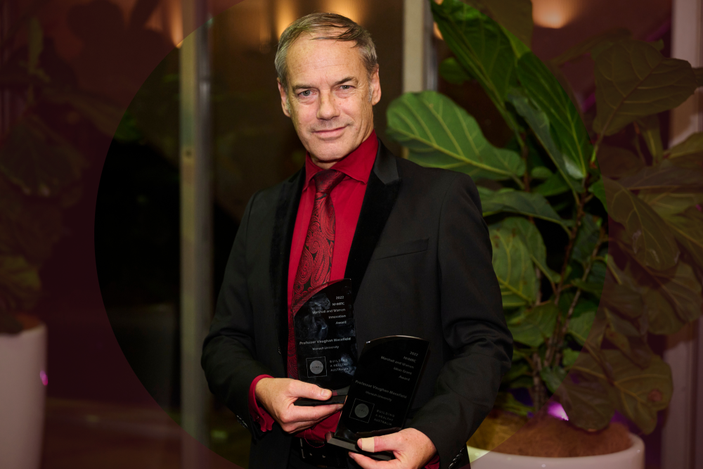 Photo of Professor Macefield holding an award