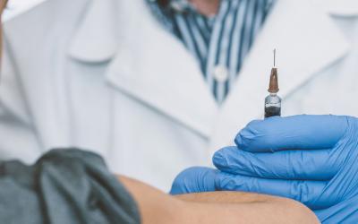 Doctor holding needle